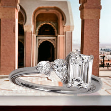 stunning emerald central diamond ring