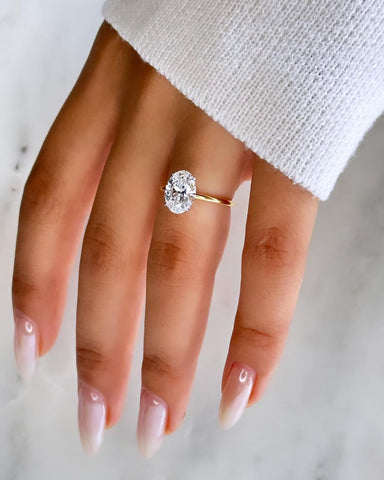 Oval Petite Four Prong Solitaire ring